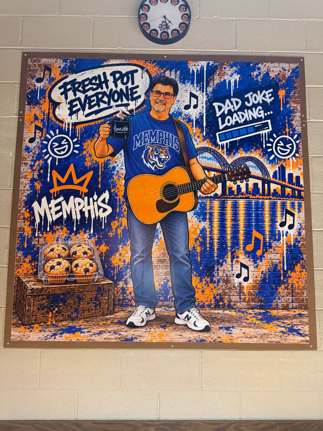 Mural of Jock holding a guitar, painted in Memphis blue and orange.