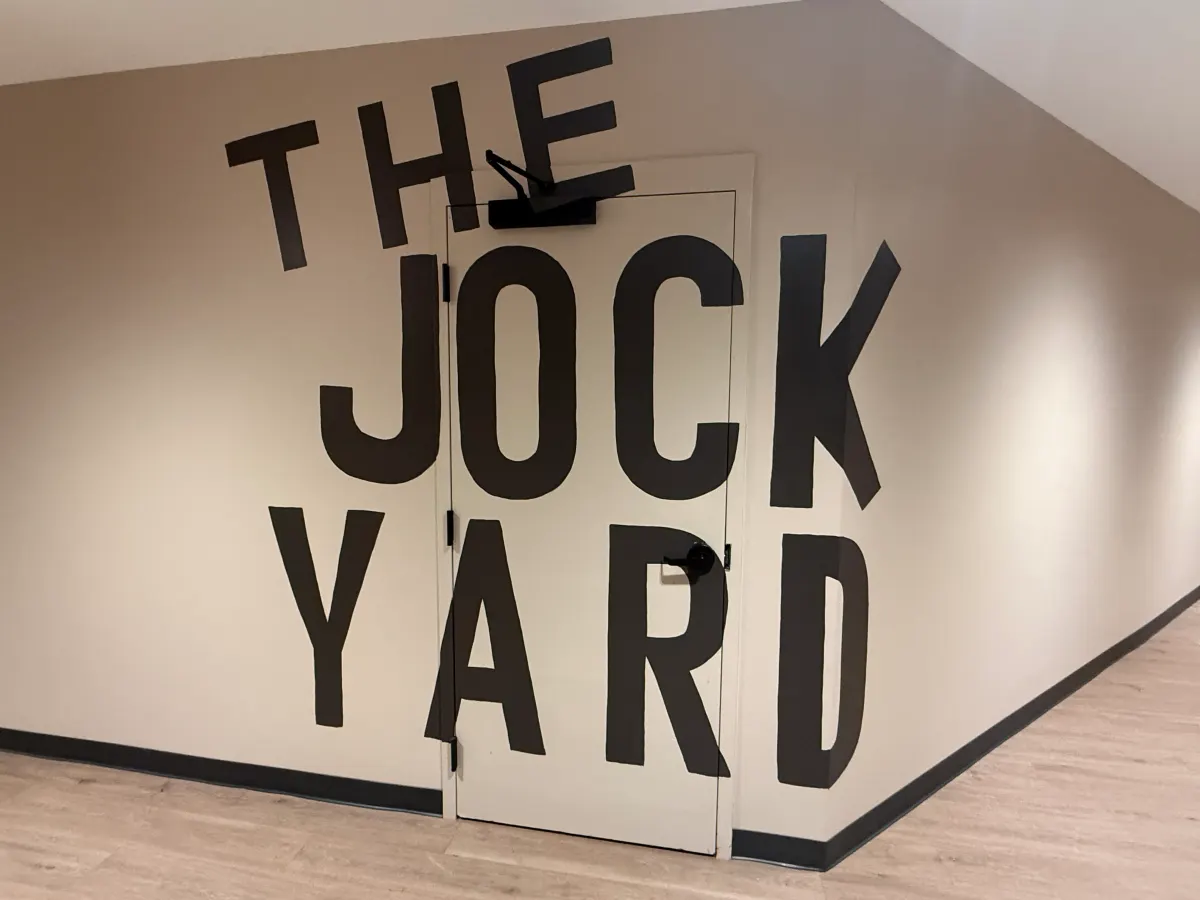 The Jock Yard sign painted on the wall outside the game room at Redeemers Structural Solutions.