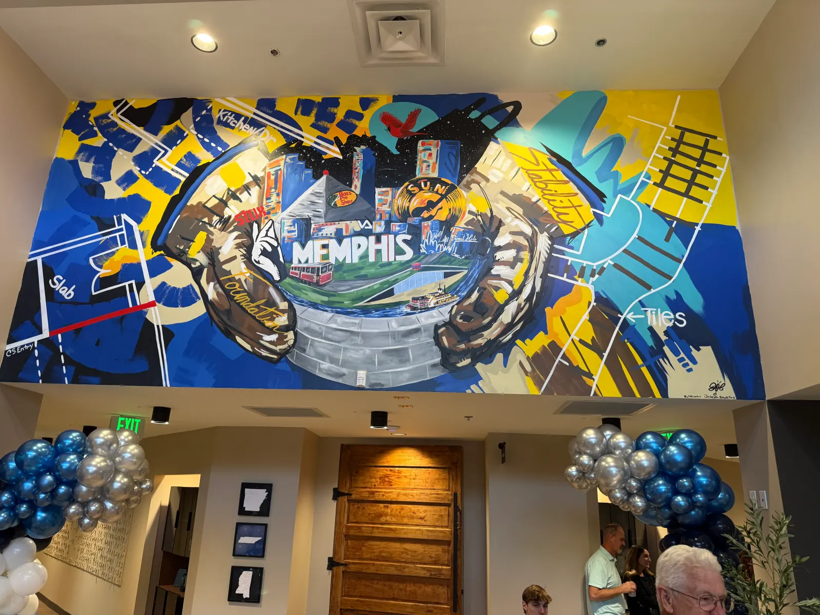 Large Memphis-themed mural above the entry hall at Redeemers Structural Solutions.