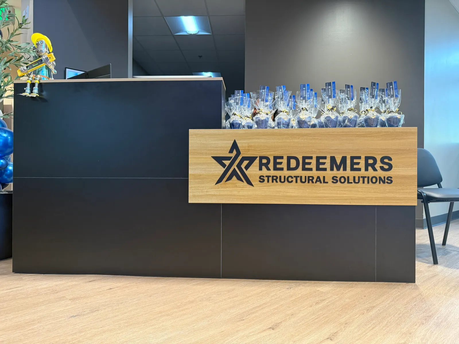 Front reception desk at the new Redeemers Structural Solutions campus in Memphis, showing the new company logo.